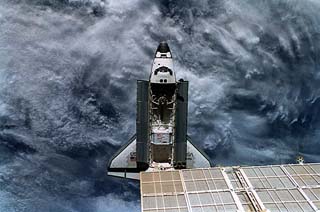 “Above” shot of the orbiter, with payload bay open, showing entire shuttle. 